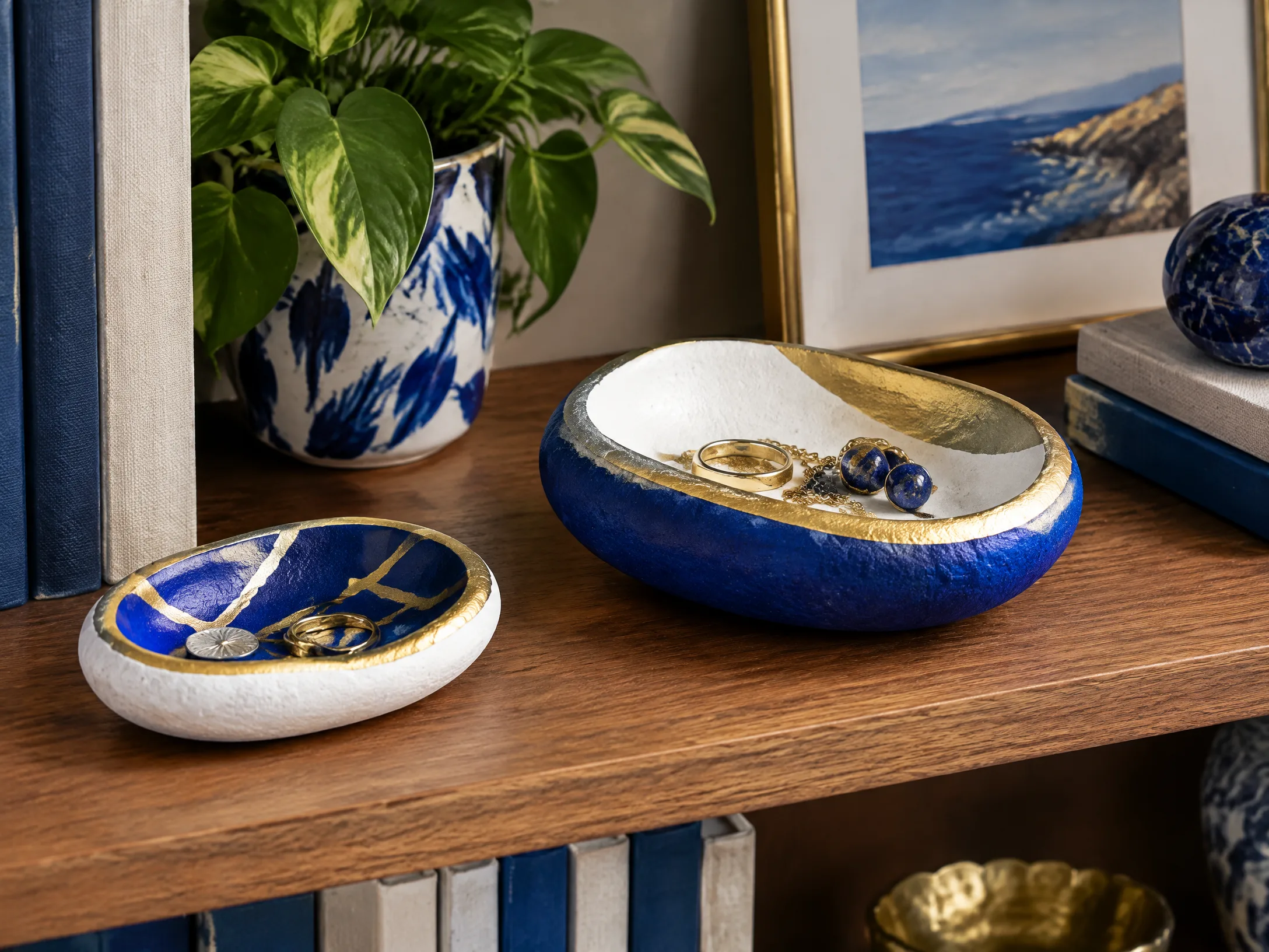 Painted stone catchall in royal blue, white, and gold