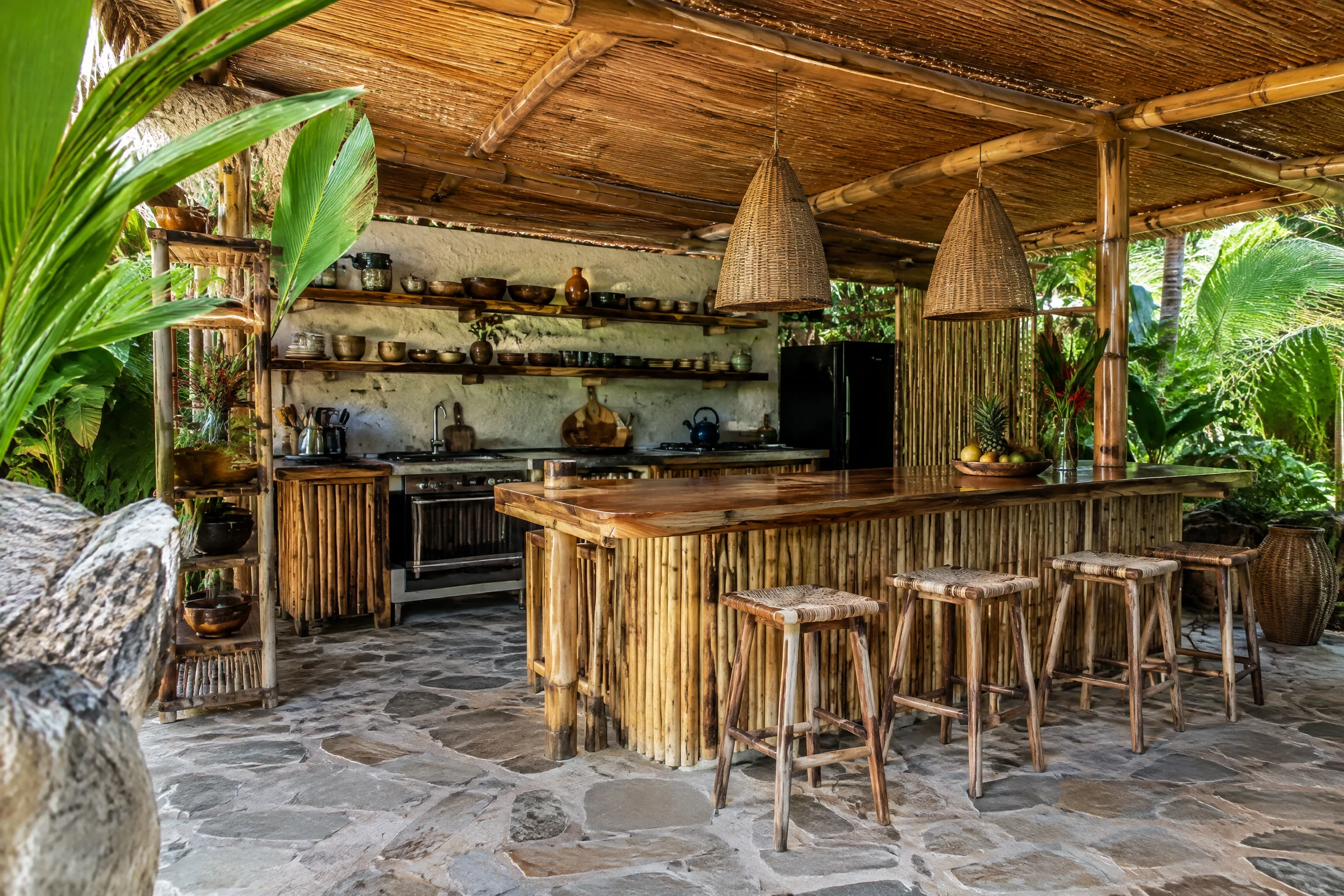 Rustic bamboo outdoor kitchen and bar with natural stone floor
